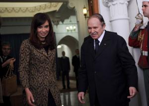 Algerian President Abdelazziz Bouteflika (R) stands with his Argentinian