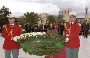 Argentine President Cristina Fernandez, rear center, lays a wreath