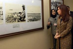 Argentine President Cristina Fernandez, right, and an unidentified guide