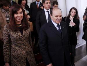 Algerian President Abdelaziz Bouteflika (2nd R) escorts his Argentinian