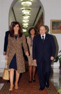 Algerian President Abdelaziz Bouteflika, right, walks with Argentine President