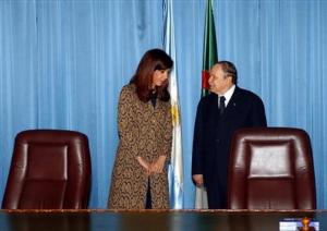 Algerian President Abdelaziz Bouteflika, right, talks with Argentine President