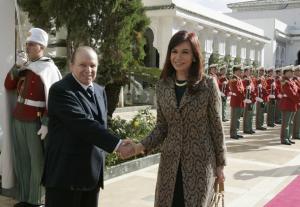 Algeria's president Abdelaziz Bouteflika (L) shakes hands with his