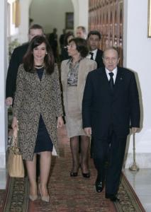 Algeria's President Abdelazziz Bouteflika (R) walks with his Argentinian