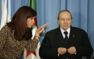 Algeria's President Abdelazziz Bouteflika (L) chats with his Argentinian